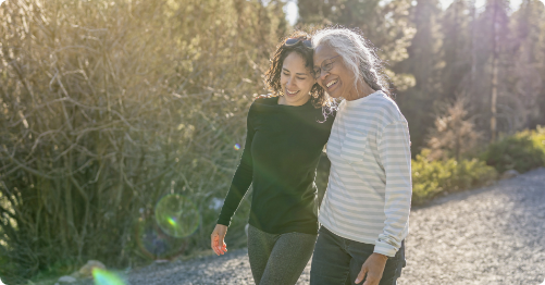 Two women walking outside.