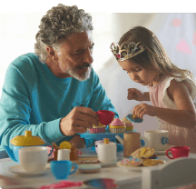 Man and child having tea party.