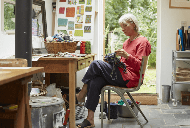 Woman sitting inside.