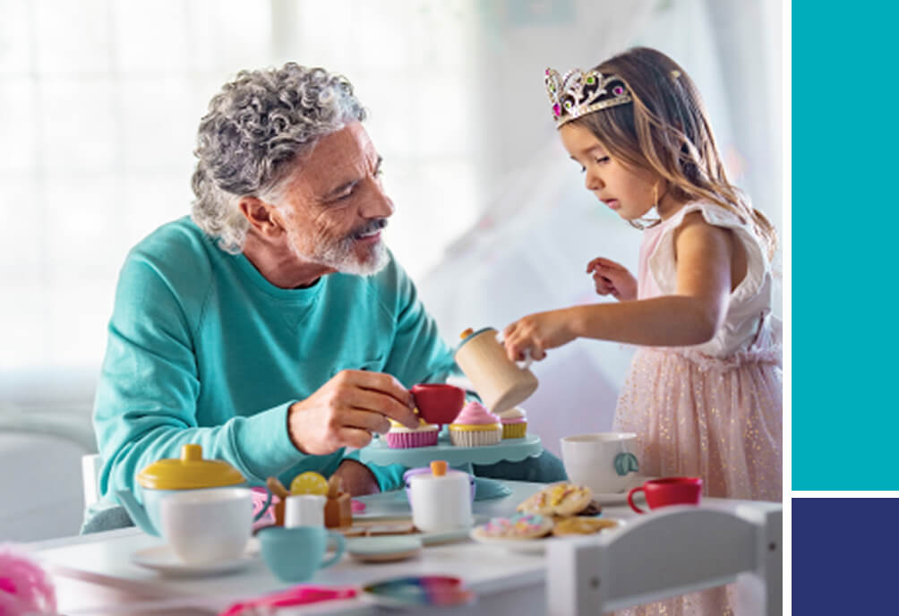 Man and child having a tea party.