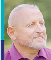 Michael, a real Epkinly patient, smiling.