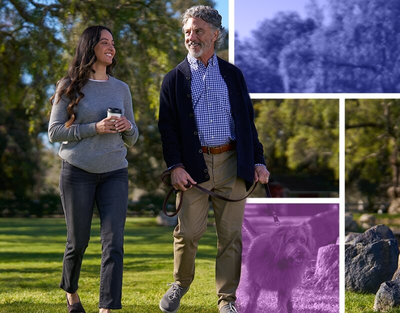 Man and woman walking dog.